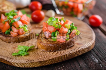 Stock photo: Bruschetta with tomatoes, garlic and herbs