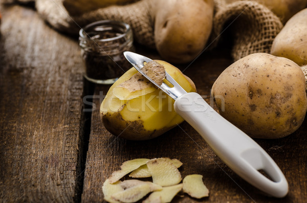 Peeling potatoes for gnocchi dougn on Stock photo © Peteer