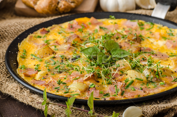 Egg omeletta with ham and herbs Stock photo © Peteer