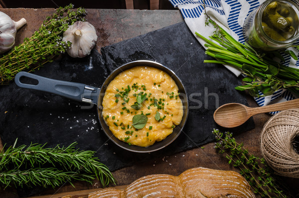 Stock photo: Scrambled eggs in a frying pan