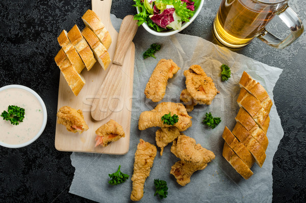 Salmon in herb batter with spicy dressing Stock photo © Peteer