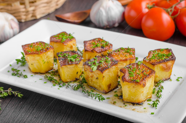 Potato fondant with garlic and herbs Stock photo © Peteer