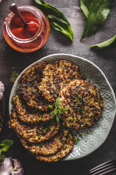 Potato pancakes fried with garlic Stock photo © Peteer