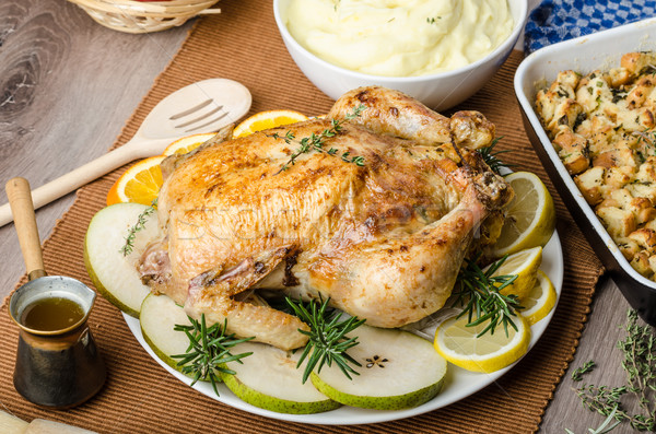 Feasting - stuffed roast chicken with herbs Stock photo © Peteer