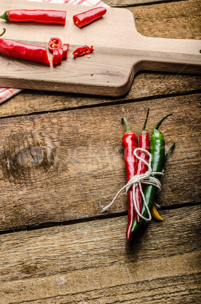 Chilli peppers, wood table, background Stock photo © Peteer