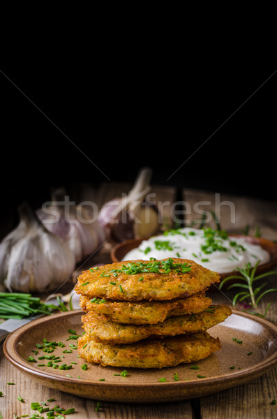 Potato pancakes with sour cream Stock photo © Peteer