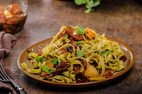 Pasta with sun dried tomatoes Stock photo © Peteer