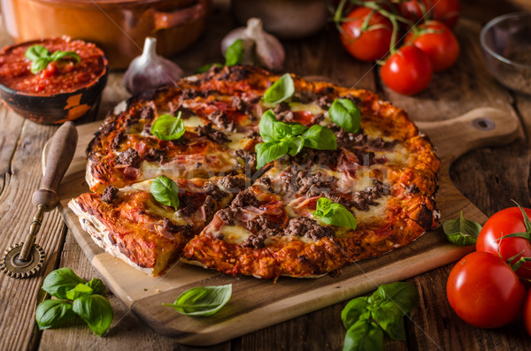Rustic pizza with minced meat Stock photo © Peteer