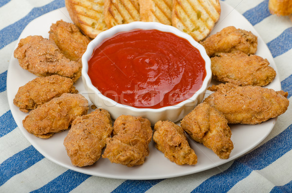 Golden Chicken Wings Stock photo © Peteer