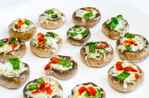 Baked muhrooms with blue cheese, red pepper and spring onion Stock photo © Peteer