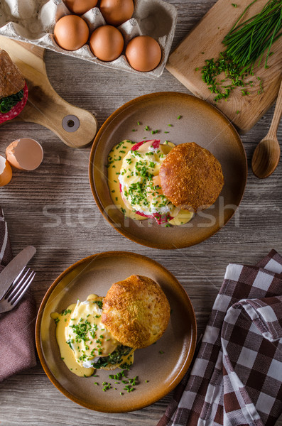 Egg benedict with hollandaise sauce Stock photo © Peteer