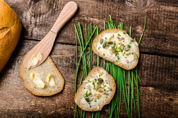 Homemade bread buttered with healthy seeds and herbs Stock photo © Peteer