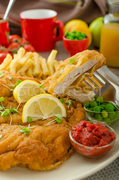 Schnitzel, french fries and microgreens salad Stock photo © Peteer