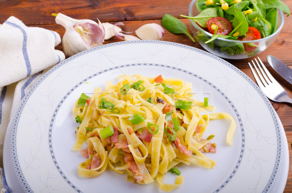 Stock photo: Italian pasta with spring onion and bacon