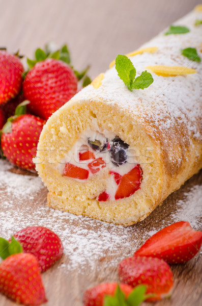 Sponge roll with strawberries and blueberries Stock photo © Peteer