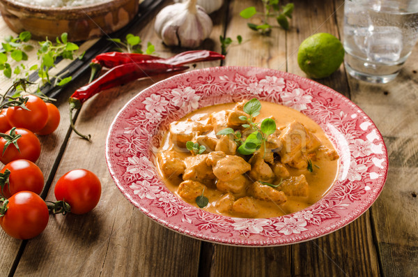 Stock photo: Chicken curry with herbs