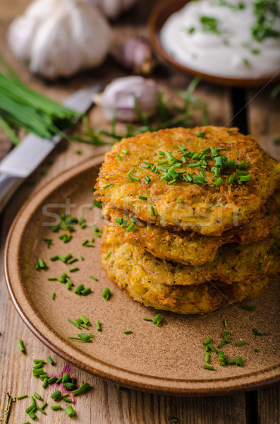 Potato pancakes with sour cream Stock photo © Peteer