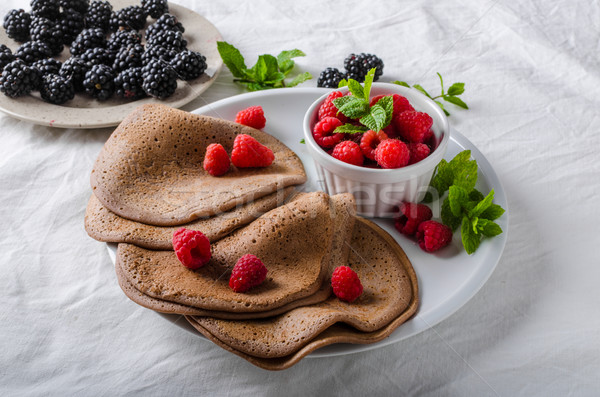 Cocoa pancakes with forest fruit Stock photo © Peteer