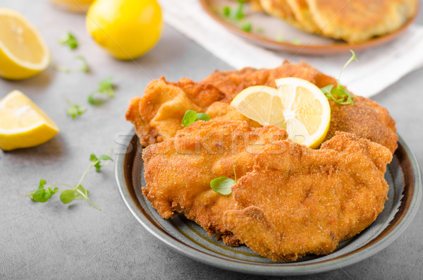 Delicious original schnitzel with potato pancakes Stock photo © Peteer