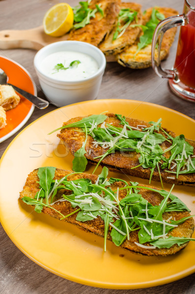 Breaded eggplant parmesan and arugula Stock photo © Peteer