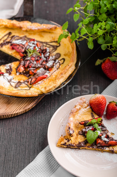 Pancake in oven, dutch baby pancake with strawberries Stock photo © Peteer