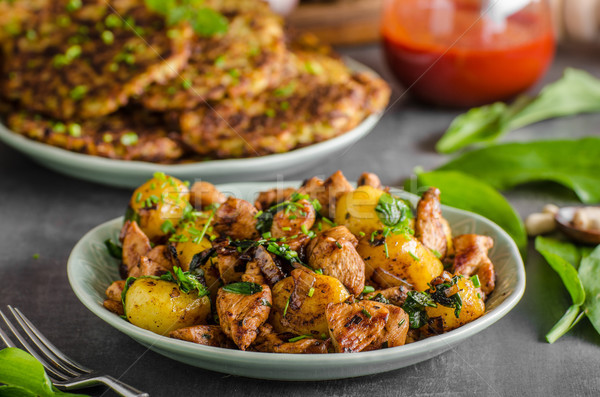 Potato pancakes, fried chicken with potatoes Stock photo © Peteer