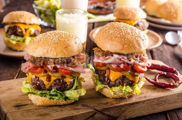 Homemade beef burger, caramelized onion, bacon and beer Stock photo © Peteer