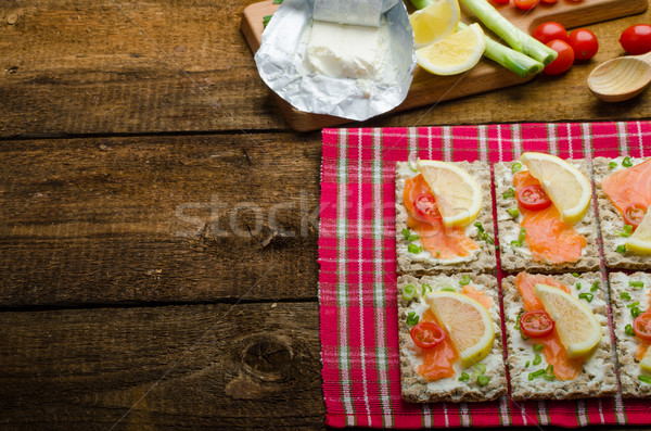 Bio healthy food - kneckebrot spread cheese with smoked salmon and cherry tomatoes Stock photo © Peteer