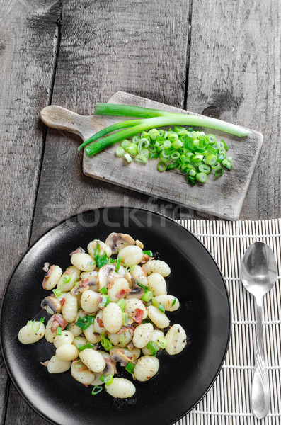Gnocchi pasta with ham, spring onion Stock photo © Peteer