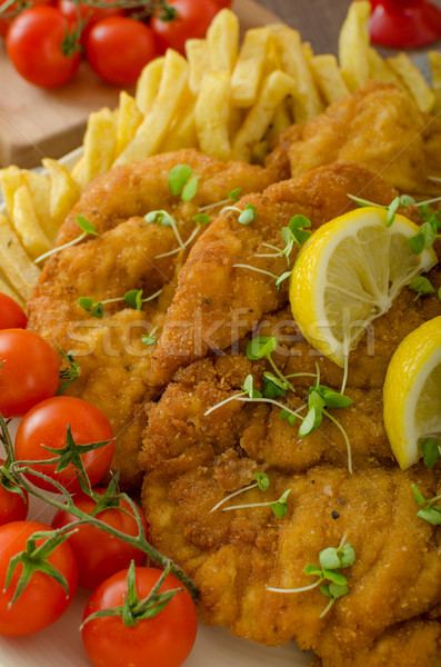 Schnitzel, french fries and microgreens salad Stock photo © Peteer