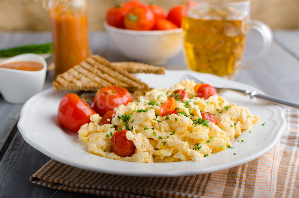 Scrambled eggs with baked tomatoes and chives, panini Scrambled eggs with baked tomatoes Stock photo © Peteer