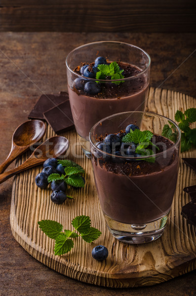 Chocolate pudding with berries and herbs Stock photo © Peteer