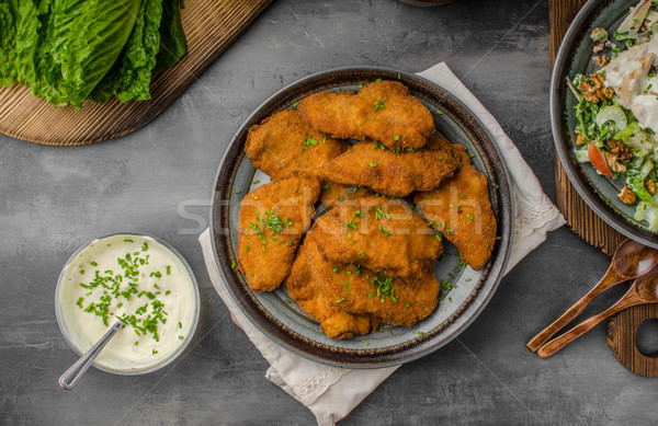 Breaded original schnitzel with waldorf salad Stock photo © Peteer