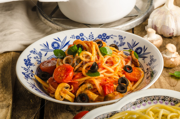 Stock photo: Pasta with olives, tomatoes and basil