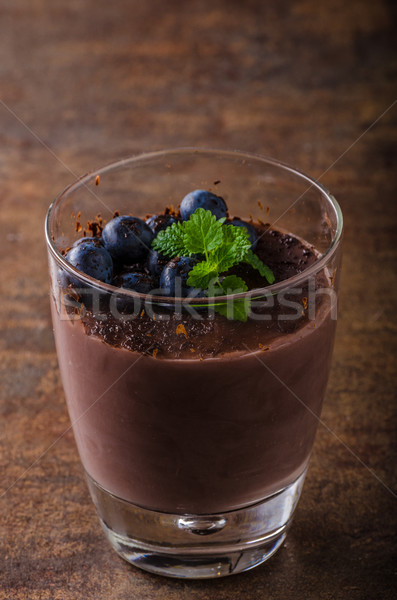 Chocolate pudding with berries and herbs Stock photo © Peteer