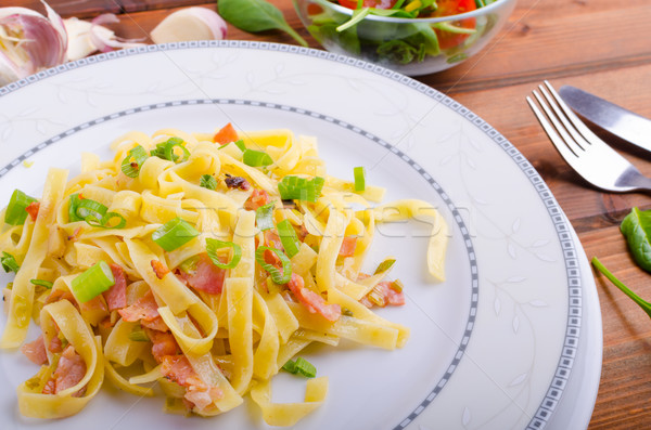 Italian pasta with spring onion and bacon Stock photo © Peteer