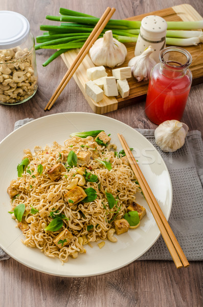 Chinese noodles with tofu and cashew nuts Stock photo © Peteer