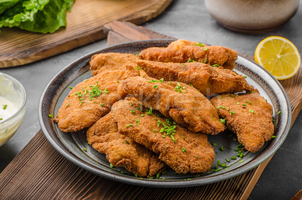 Breaded original schnitzel Stock photo © Peteer