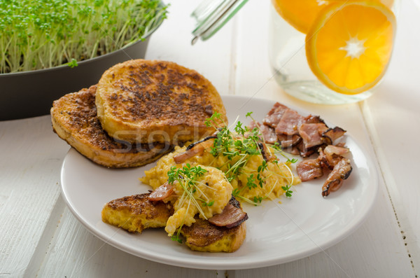 Scrambled eggs with French toast topped with watercress Scrambled eggs with watercress, french toast Stock photo © Peteer
