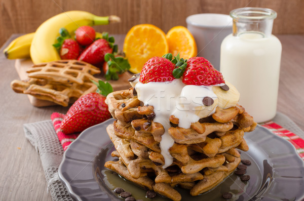 Belgian waffles with chocolate chips and fruits Stock photo © Peteer