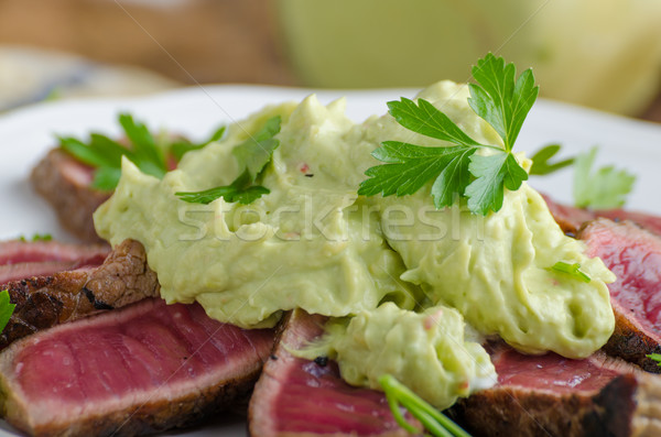 Beef steak with avocado dip and herbs Stock photo © Peteer