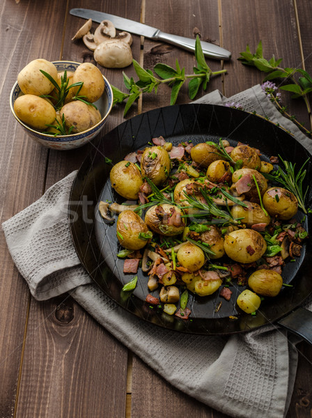 Cowboy potatoes with bacon and herbs Stock photo © Peteer