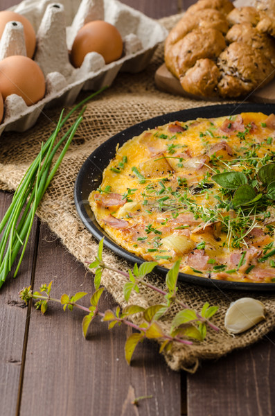 Egg omeletta with ham and herbs Stock photo © Peteer