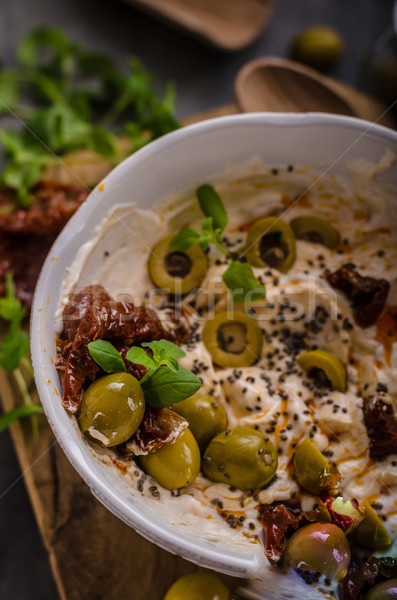 Fresh cheese with olives, dried tomatoes Stock photo © Peteer