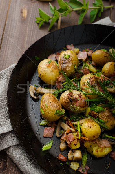 Cowboy potatoes with bacon and herbs Stock photo © Peteer