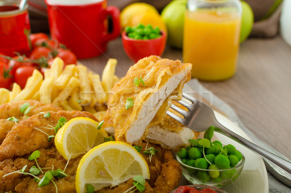 Schnitzel, french fries and microgreens salad Stock photo © Peteer