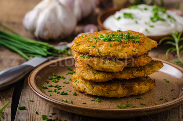 Potato pancakes with sour cream Stock photo © Peteer