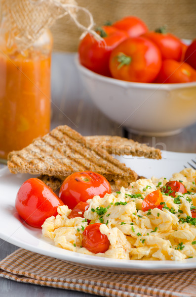 Stock photo: Scrambled eggs with baked tomatoes and chives, panini Scrambled eggs with baked tomatoes