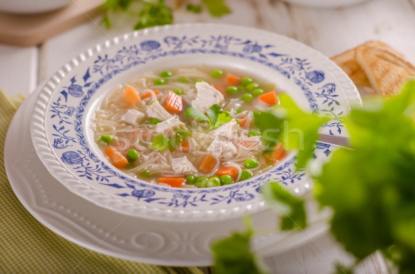Spring chicken soup noodles, vegetable and toast Stock photo © Peteer