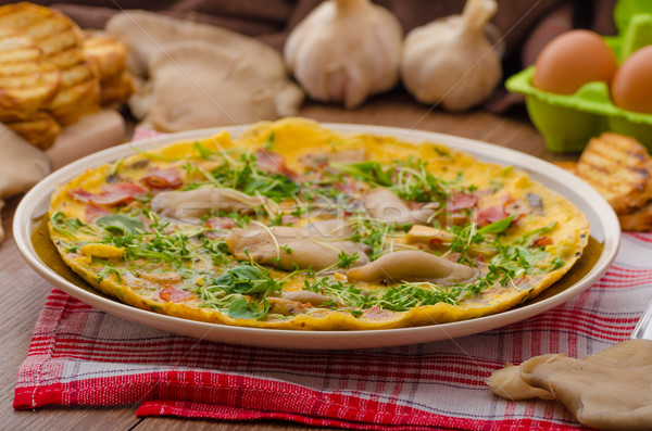 Stock photo: Omelette with smoked meat and mushrooms